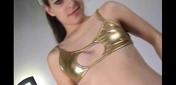  Petite amateur Michaela teasing in shiny gold PVC